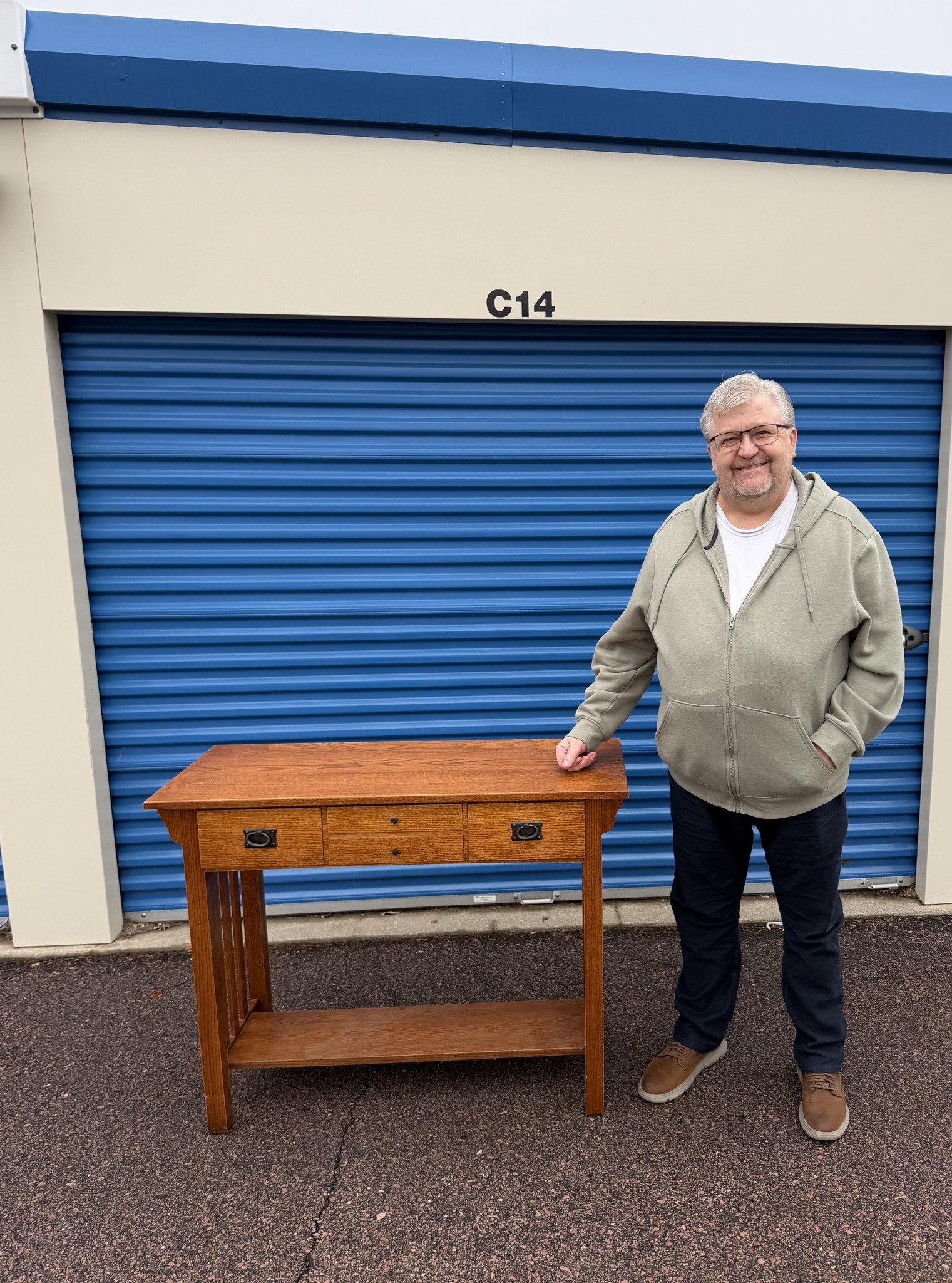 A solid oak Mission-style desk pulled from a Sioux Falls storage unit cleanout, rehomed instead of landfilled
